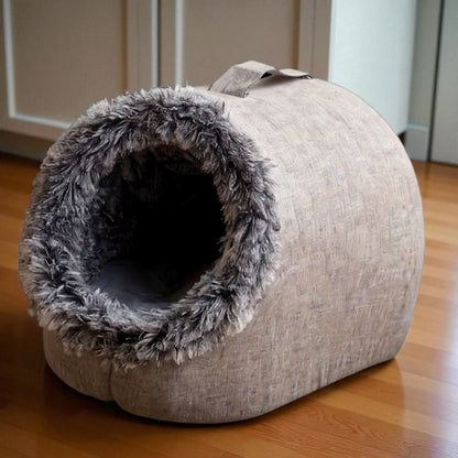 Comfortable and portable cat bed, warm and padded, with handle.