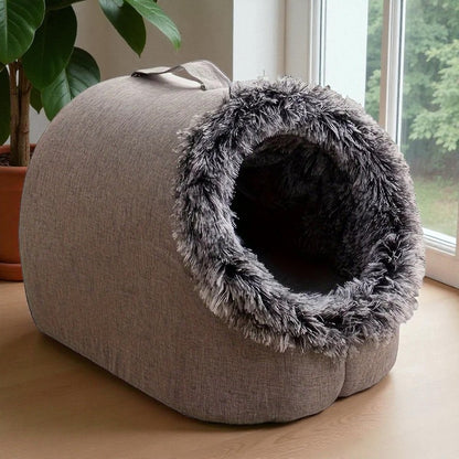 Comfortable and portable cat bed, warm and padded, with handle.