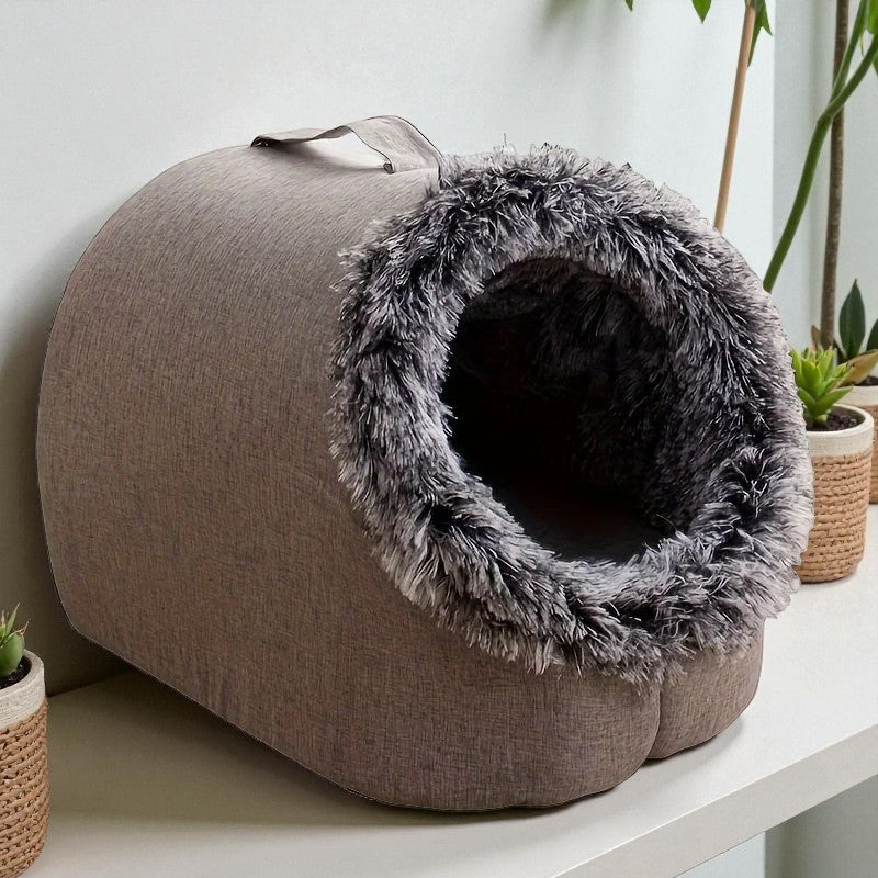 Comfortable and portable cat bed, warm and padded, with handle.