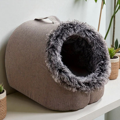 Comfortable and portable cat bed, warm and padded, with handle.